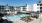 pool showing reclining seating and nearness to property buildings