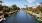 a river with canoes and kayaks