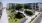 courtyard with grass hills and trees