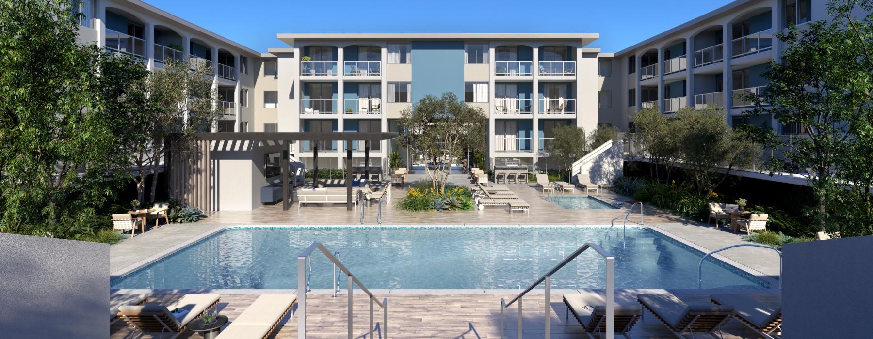 lounge chairs next to swimming pool